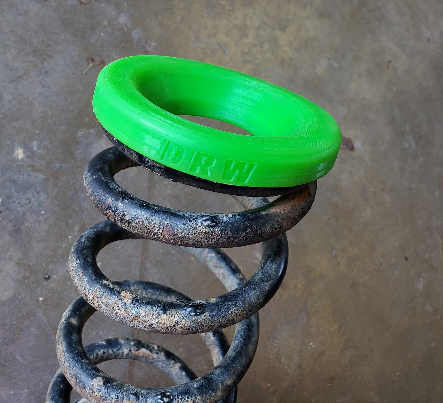84'-94' Justy Rear Upper Spring Seat/Insulator