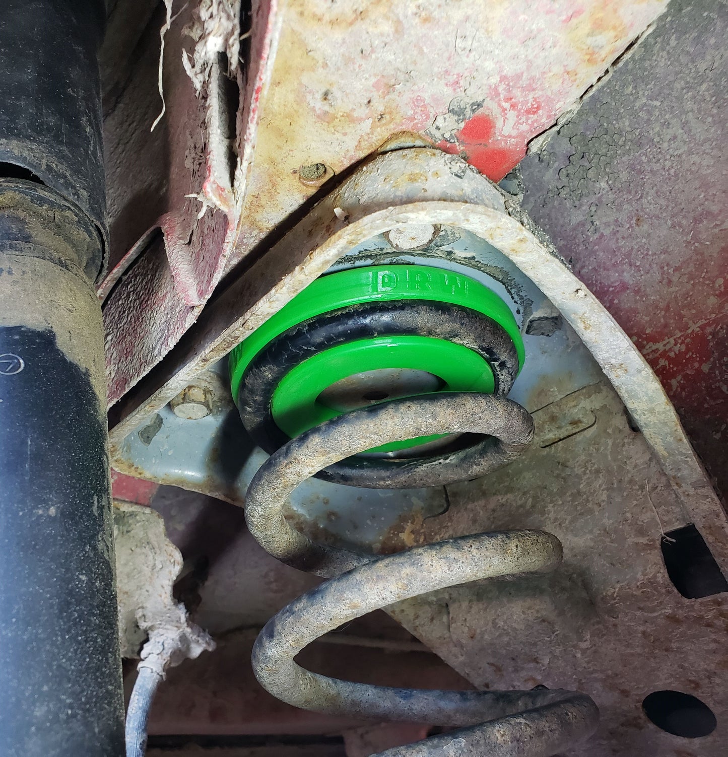 84'-94' Justy Rear Upper Spring Seat/Insulator